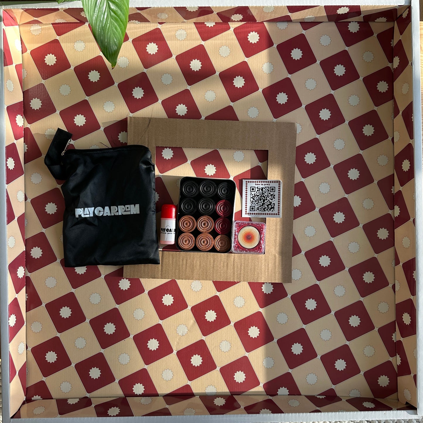 Carrom kit inside of carrom box.